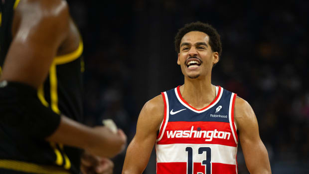 Dec 22, 2023; San Francisco, California, USA; Washington Wizards guard Jordan Poole (13) reacts toward former teammate Golden State Warriors forward Jonathan Kuminga during the first quarter at Chase Center. Mandatory Credit: D. Ross Cameron-USA TODAY Sports